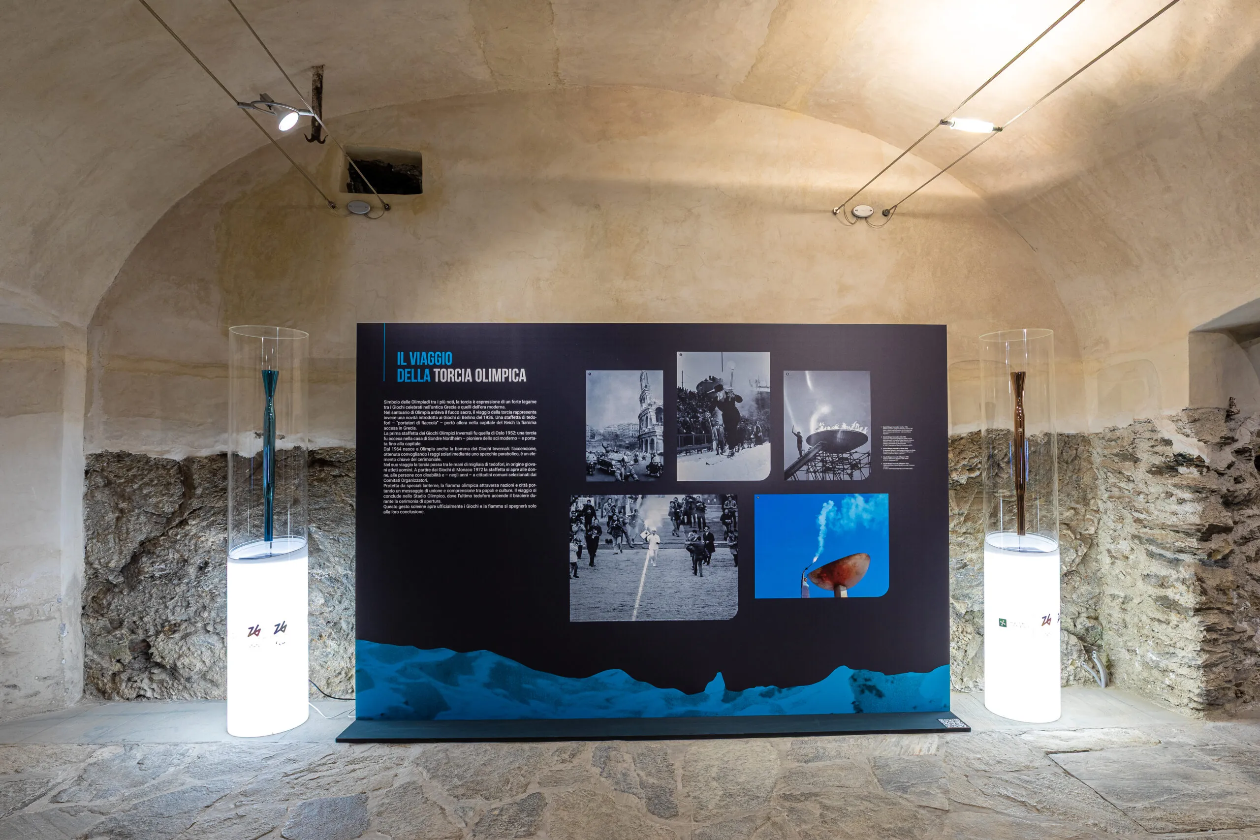 Un pannello della mostra è dedicato al viaggio della torcia olimpica, affiancato - per la giornata inaugurale della mostra - dalle torce delle Olimpiadi e Paralimpiadi Milano Cortina 2026.